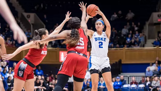 Haley Gorcki shooting over two NC State defenders