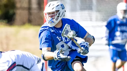 Jordan Ginder wins a faceoff and picks up the ground ball.