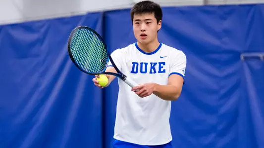 Andrew Zhang gets ready to serve against UNCW on Sunday