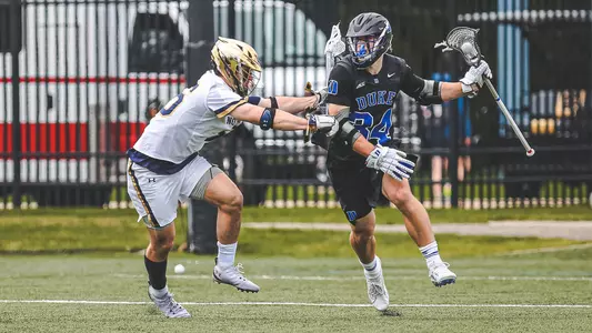 Brennan O'Neill dodges against a Notre Dame defenseman