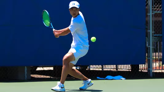 Andrew Zhang focuses on hitting the ball during Duke's NCAA Championship match with South Florida