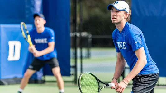 Arturo Kam and Andrew Dale compete against Notre Dame in doubles play