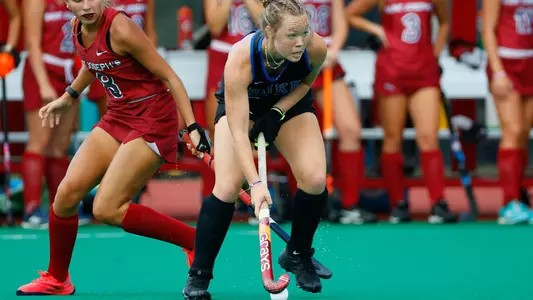 Issy Carey passes the ball against Saint Joseph's