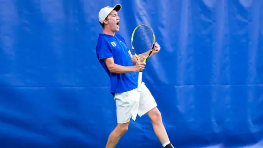 Andrew Dale celebrates after his singles win