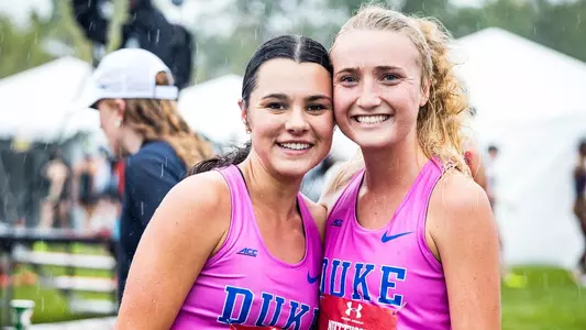 charlotte tomkinson and kelli wilson smile after competing at nuttycombe invite