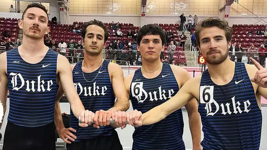 Duke men's DMR poses for photo after breaking school record