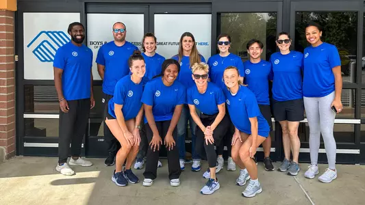 Duke Athletics volunteers pose outside the Boys & Girls Club during the 2024 919 Day of Service.