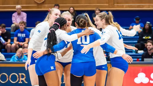Duke volleyball celebrates as it defeats Boston College in Cameron indoor stadium