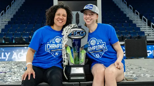 Kara Lawson and Toby Fournier with ACC Championship Trophy