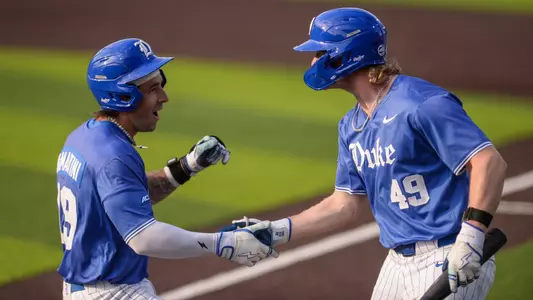 Michael DiMartini and Kaden Smith celebrate