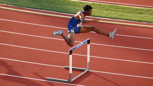 Andres Langston clears a hurdle at the NCAA Outdoor Championships