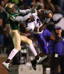 Mark Walker, right, intercepts a pass intended for UAB's Reggie Lindsey during the second quarter Friday