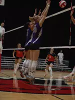 (l-r) Loren Barry and Anna Vaughn combine for a double-block over Illinois.