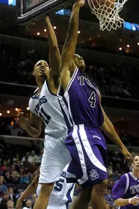 Nile Murry (4) charges to the basket over Memphis' Duane Erwin (11) during the second half Saturday, Jan. 15, 2005 at the FedEx Forum in Memphis, Tenn. Murry led TCU to a 61-59 victory over Memphis with 17 points. (AP Photo/Lance Murphey)