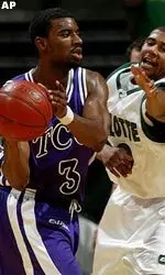Charlotte's Mitchell Baldwin reaches for the ball against TCU's Corey Santee in the first half. (AP Photo/The Charlotte Observer, Chris Keane)