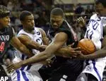 Cincinnati forward Erick Hicks and forward Jason Maxiell, grab for the ball against TCU forward Marcus Sloan, second from left, and center Femi Ibikunle, right, in the first half,. (AP Photo/Donna McWilliam)
