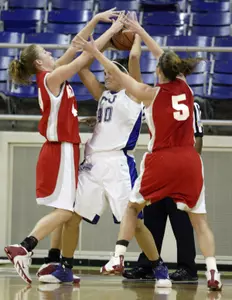 New Mexico's Angela Hartill, left, and guard Abbie Letz (5) surround TCU's Jenna Lohse in the first half. (AP Photo/David Pellerin)