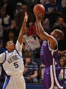 Brent Hackett, right, shoots over Air Force's Matt McCraw. (AP Photo/The Gazette, David Bitton)