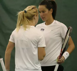 Anna Sydorska (back) talks to partner Ana Cetnik
