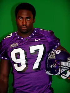 Tommy Blake poses for the video board at media day