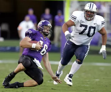 Jeff Ballard scrambles during the first half. (AP Photo/Donna McWilliam)