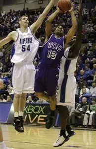 TCU guard Neil P. Dougherty, center, puts up a shot as Air Force center John Frye, left, and guard Matt McCraw defend in the first half. (AP Photo)