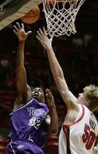 Kevin Langford powers to the hole against Utah. (AP Photo/Douglas C. Pizac)
