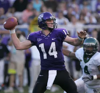 TCU quarterback Andy Dalton (14) looks to throw the ball as Baylor strong safety Jeremy Williams (4) puts pressure on him in the fourth quarter. (AP Photo/Donna McWilliam)