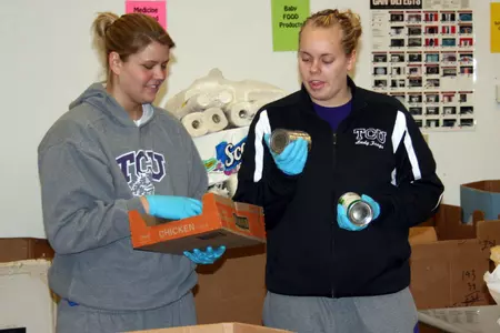 Freshman Micah Garoutte and several of her teammates spend part of their Wednesday volunteering at the Tarrant Area Food Bank.