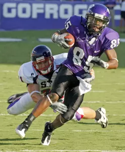 Jeremy Kerley tries to shake off a tackle by Stephen F. Austin's Cory Barlow (AP Photo/Fort Worth Star-Telegram, Sharon M. Steinman)