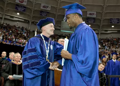 TCU Chancellor Dr. Victor Boschini and Daryl Washington