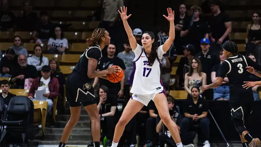 Clara Silva raises her arms outside the paint to defend a passing lane.