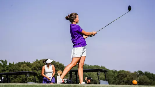 Ella Forss follows through on a tee shot and tracks her ball path