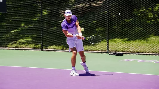 Cooper Woestendick connects on a backhand during an NCAA Super Regional match vs. Stanford
