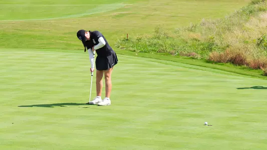Gracie McGovern watches a birdie putt roll into the hole 