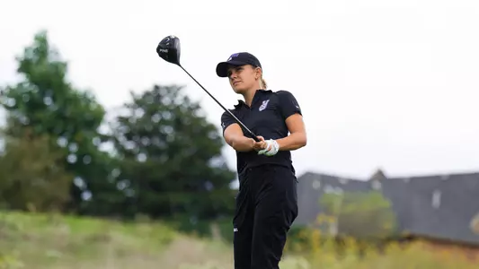 Camille Min-Gaultier follows through on a tee shot and tracks her ball