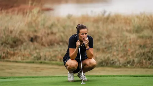 Ella Forss reads the green ahead of a birdie putt attempt.