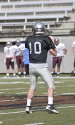 Jordan Johnson turns to throw during a 7-on-7 drill.