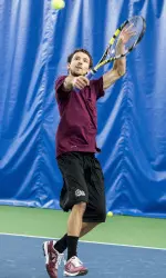 Andrew Warren won his match at No. 2 singles