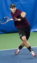 Mikolaj Caruk won in straight sets at No. 1 singles.