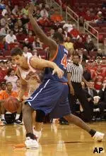 Ilian Evtimov looks to drive on Elton Brown.