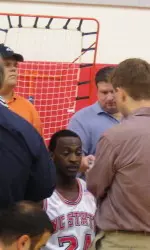 Julius Hodge is surrounded by writers during NC State's media day.