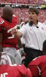NC State assistant coach Todd Stroud instructs the defensive line