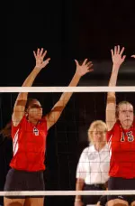 Junior middle blocker Stefani Eddins (left) led the Wolfpack with 13 kills, while senior outside hitter Melanie Rowe tacked on another nine kills Tuesday night against the Tar Heels.