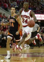 Julius Hodge does a little high-stepping as he brings the ball upcourt past Campbell's Dominique Klein during the first half.