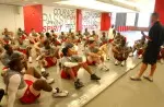 Head strength and conditioning coach, Pat Meyer, goes over the day's workout with the Wolfpack