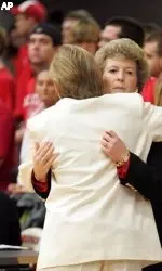 Associate head coach Stephanie Glance hugs North Carolina coach Sylvia Hatchell following No. 4 UNC's 77-75 victory Friday night