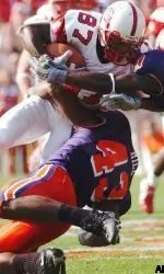 Pack receiver Brian Clark tries to get away from Clemson tacklers in last year's game.
