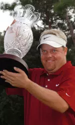 Carl Pettersson holds the tournament trophy after winning the Chrysler Championship finishing with a 9-under 275. (AP Photo/Steve Nesius)