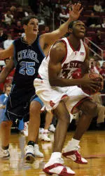 Cedric Simmons goes up for a shot around The Citadel's Andy Miller during the first half.